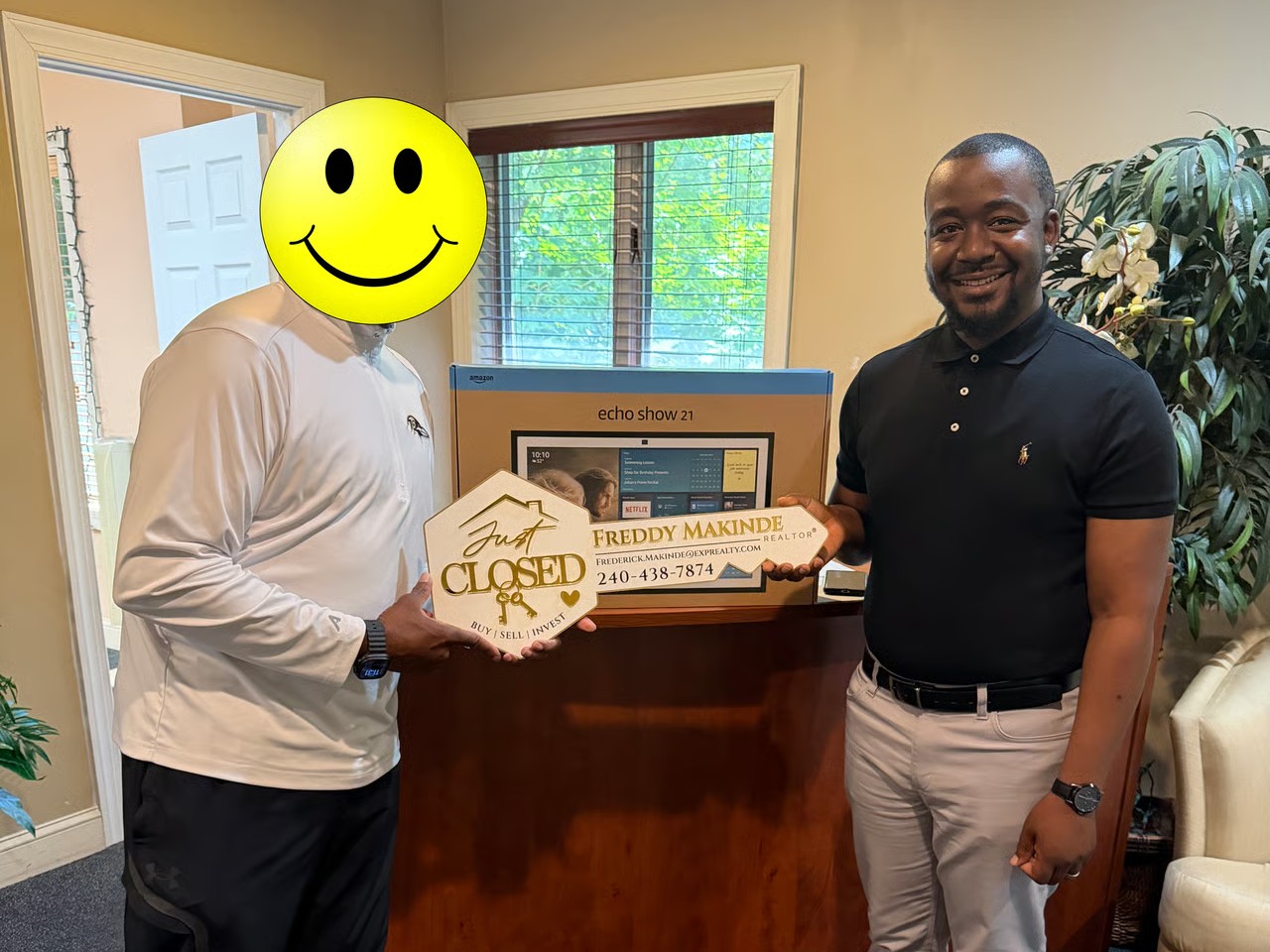 Buyer receiving keys after successfully purchasing a home through a real estate auction